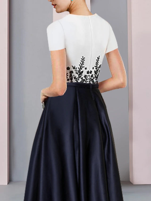 Back view of the elegant satin Mother of the Bride dress, showcasing its sleek silhouette.