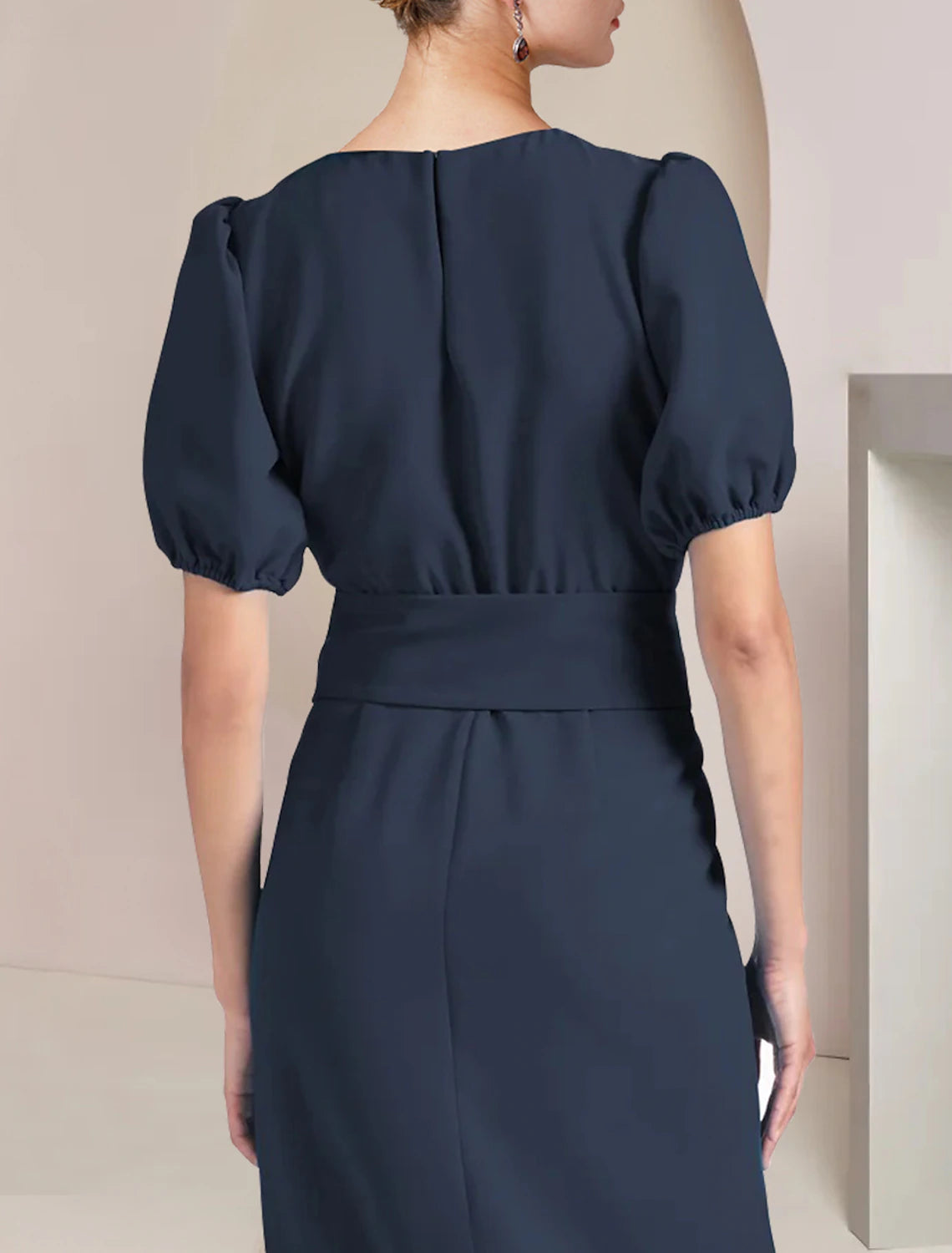 Back view of formal wedding guest dress.