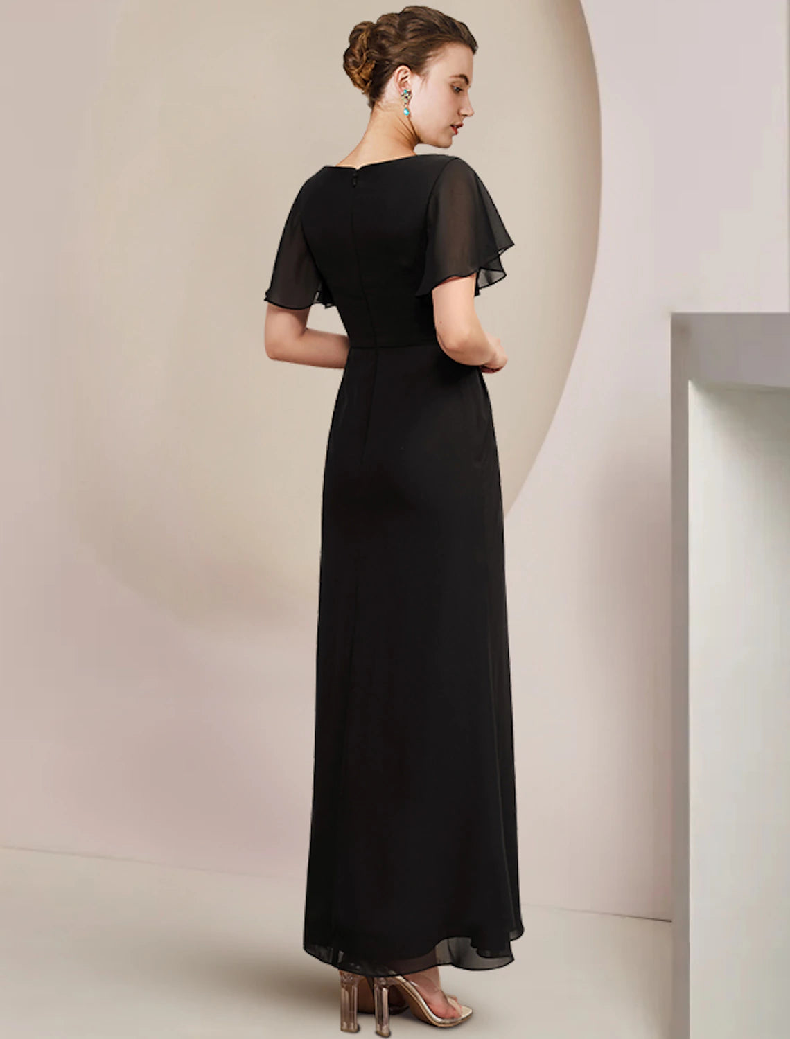Back view of the elegant short sleeve chiffon gown.