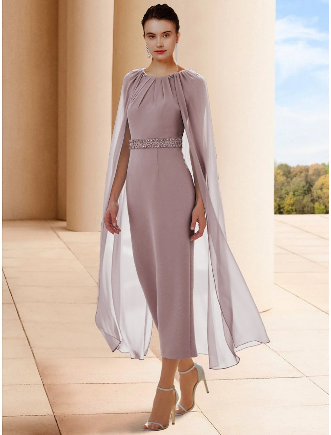 Elegant sheath mother of the bride dress with scoop neck, beading, and ruching.