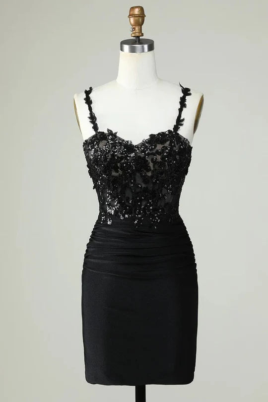 Short sheath homecoming dress with spaghetti straps and floral appliques.