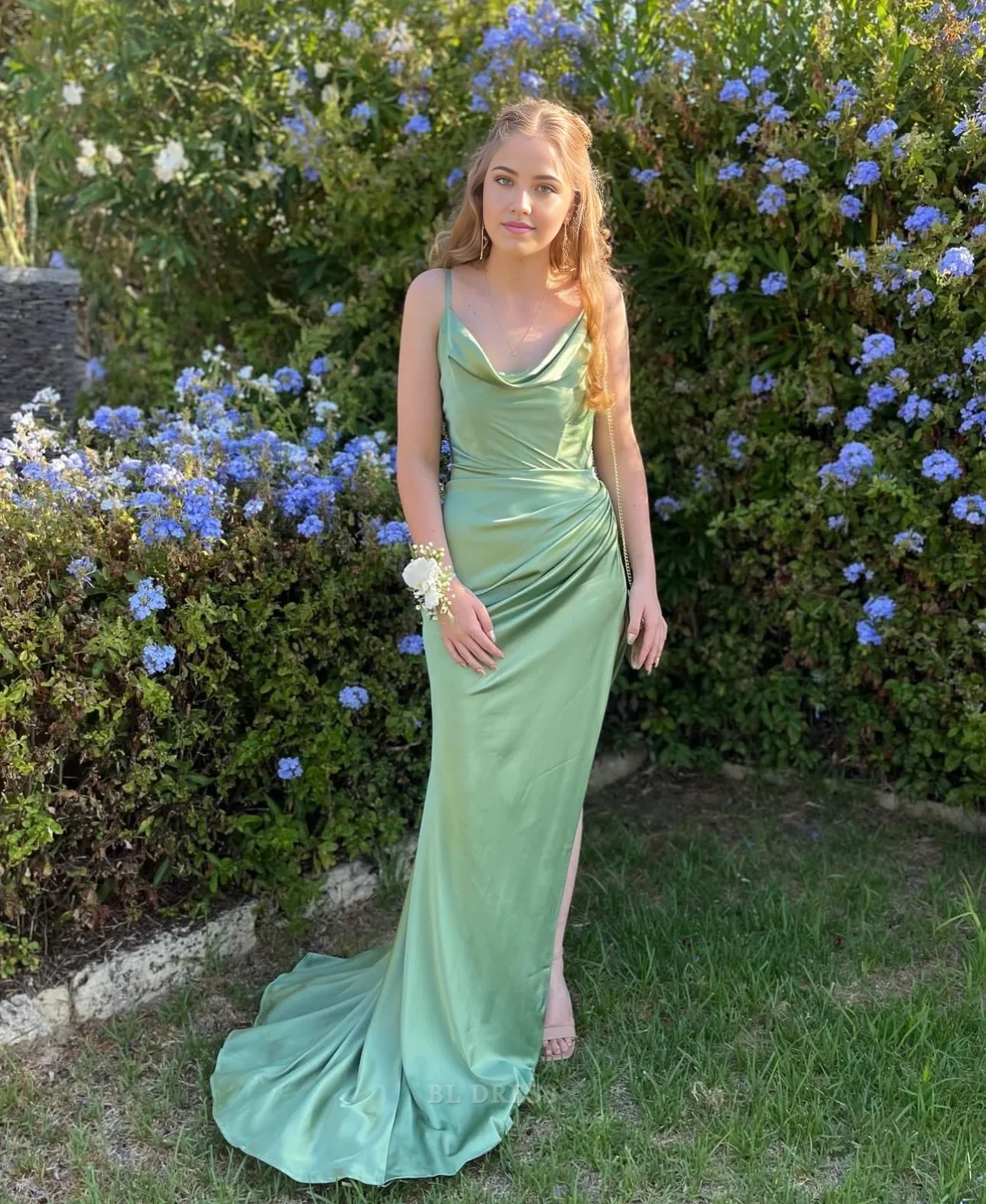 Elegant green sheath dress with delicate spaghetti straps.
