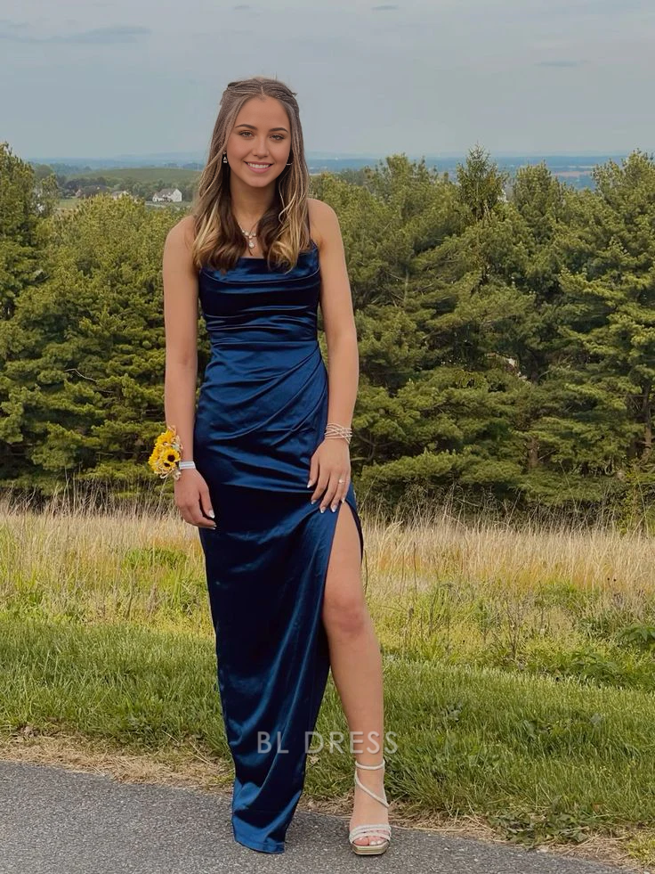 Navy blue satin sheath dress with spaghetti straps and pleated details.