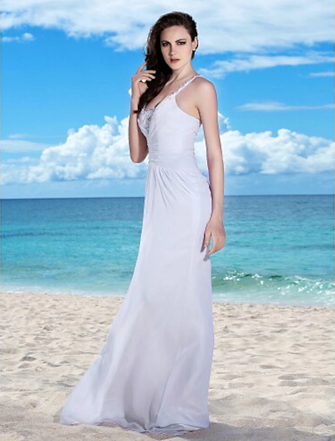 Detail of beading and fabric on a beach wedding dress.
