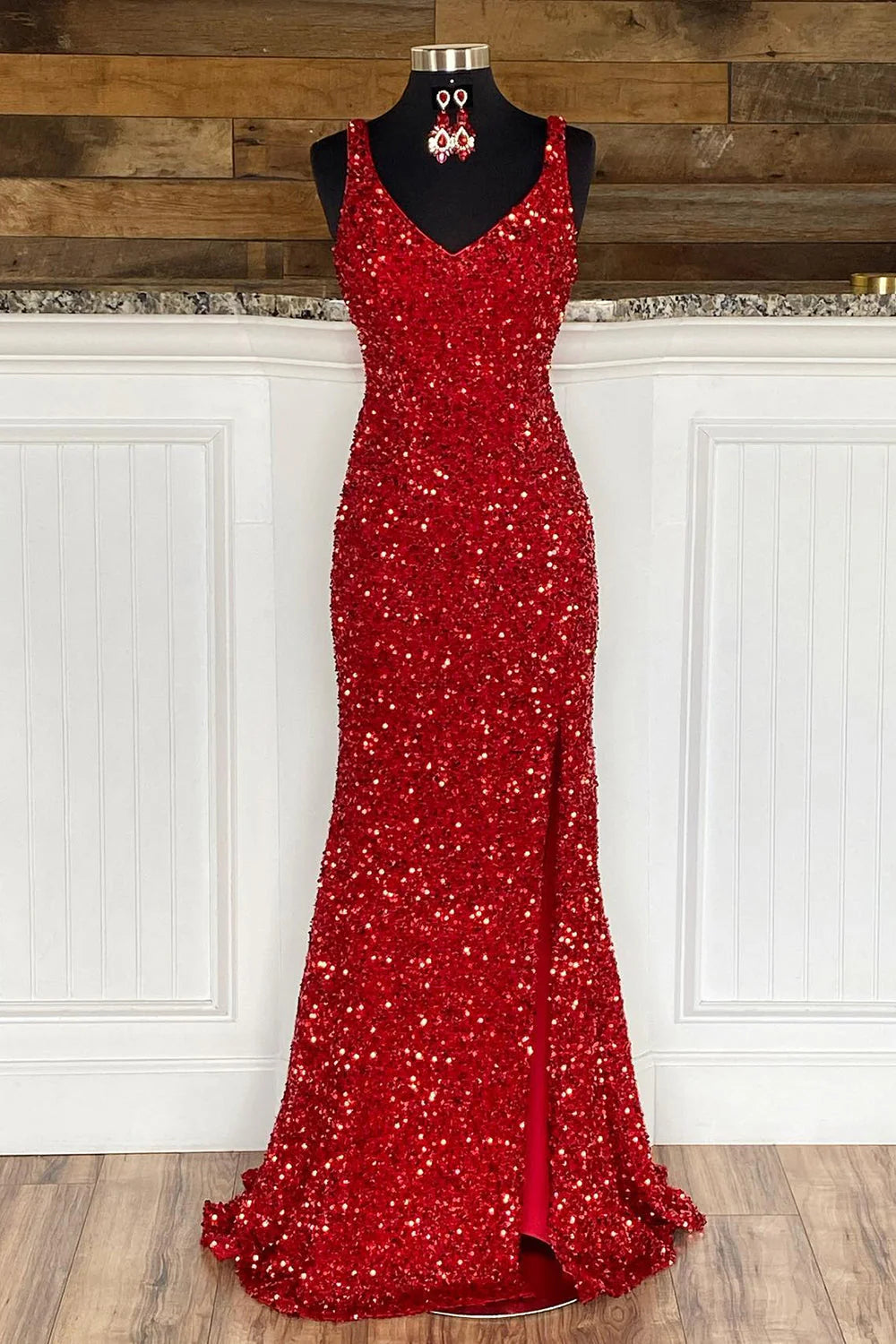 Elegant red sequin sheath prom dress with spaghetti straps and a high split front.