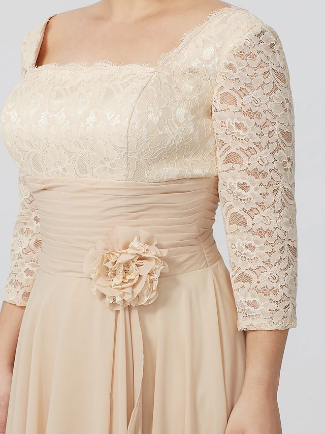 Close-up of the square neckline and 3/4 sleeve detail on the formal dress.