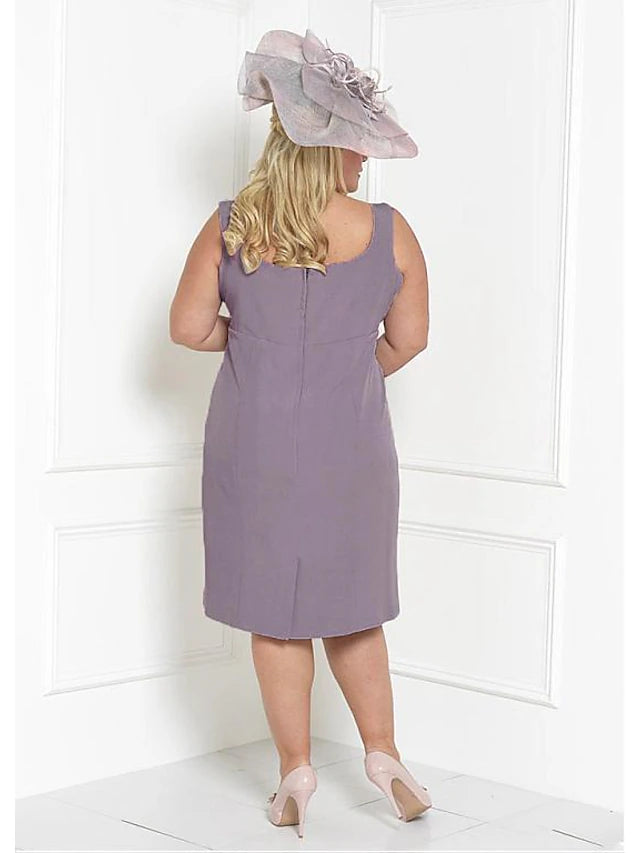 Plus size model wearing the two-piece Mother of the Bride dress with included wrap.
