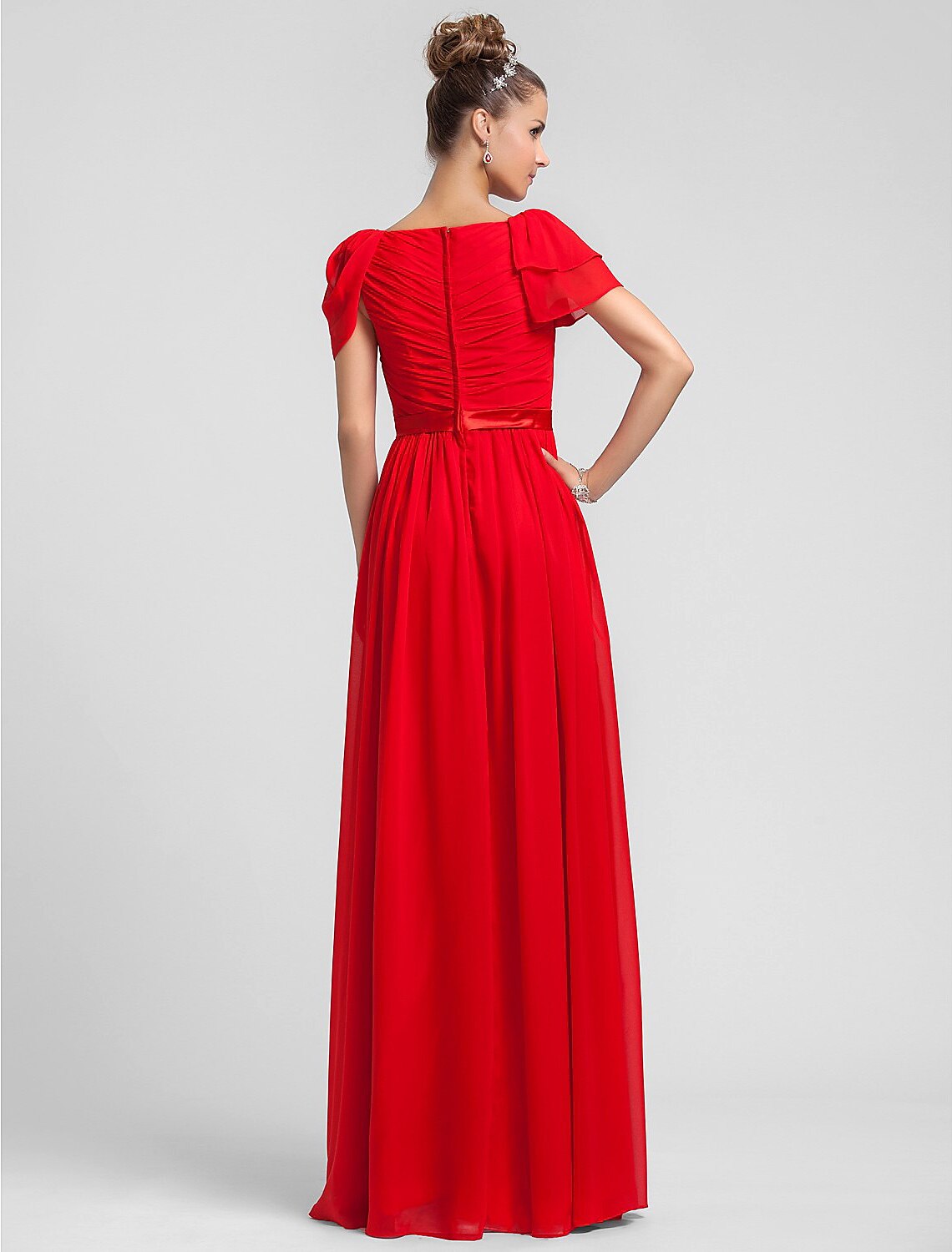 Back view of a floor length chiffon bridesmaid dress.