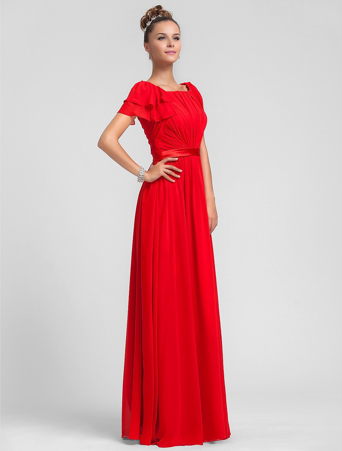 Close-up of the square neckline and chiffon fabric on the dress.