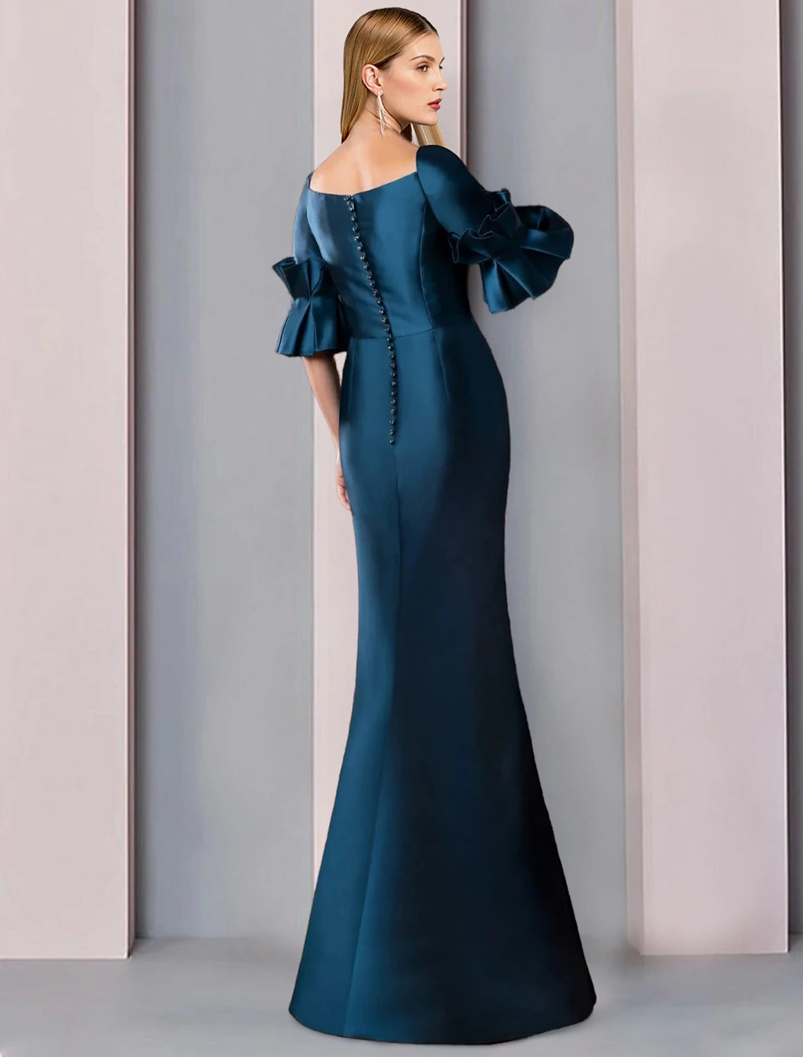 Back view of a floor-length satin mother of the bride dress.