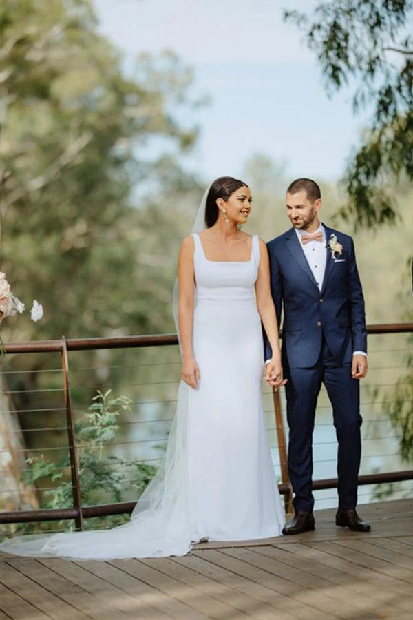 Full length view of the simple sheath wedding dress.