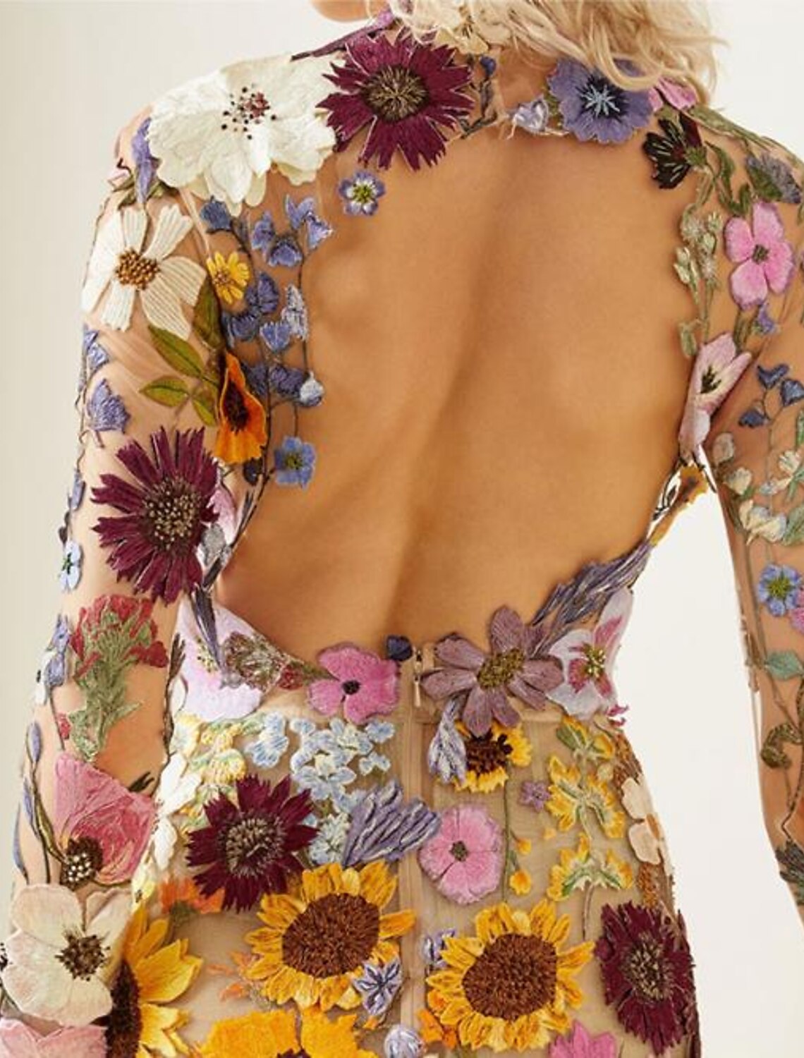 Back view of a royal blue mini party dress featuring a backless design.