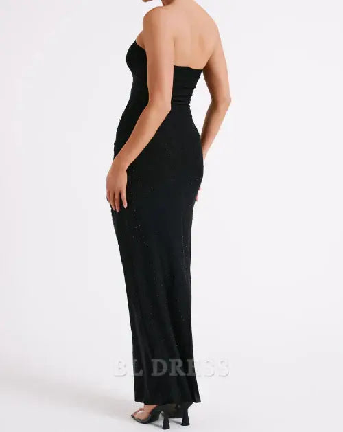 Close-up of the bodice of a black strapless sheath dress.