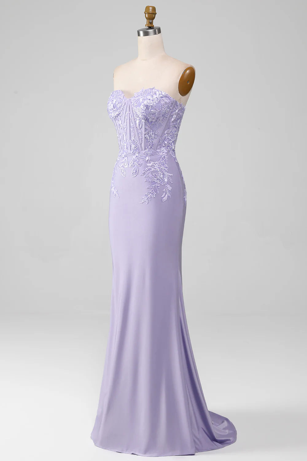 Side profile of a lilac sheath prom dress, highlighting the corset detail.