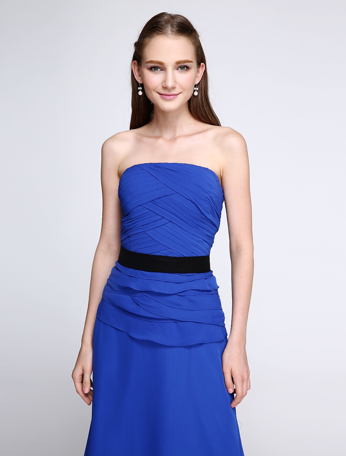 Model posing in the floor-length bridesmaid dress, showcasing its flow.