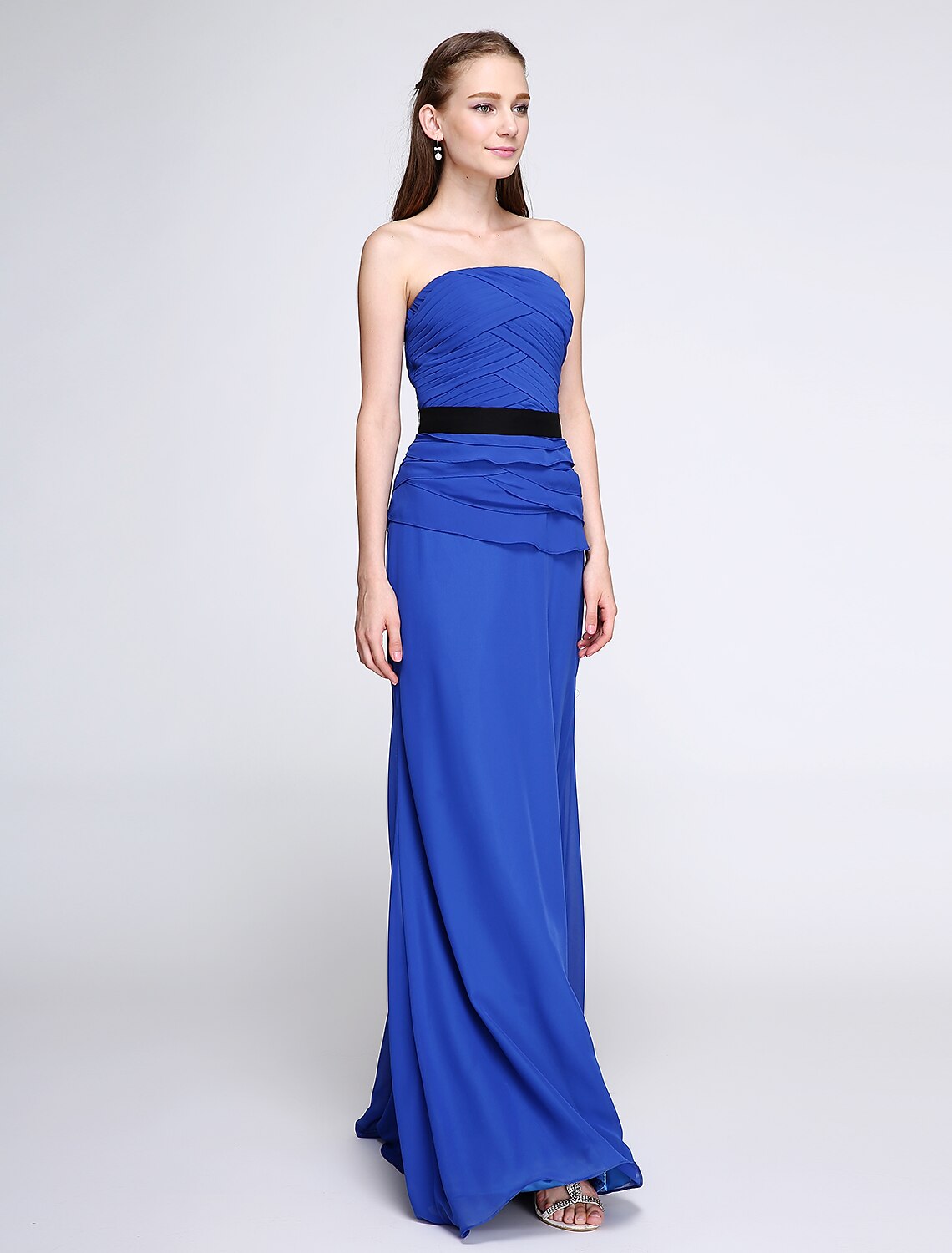 Detailed view of the strapless neckline and chiffon texture of the dress.