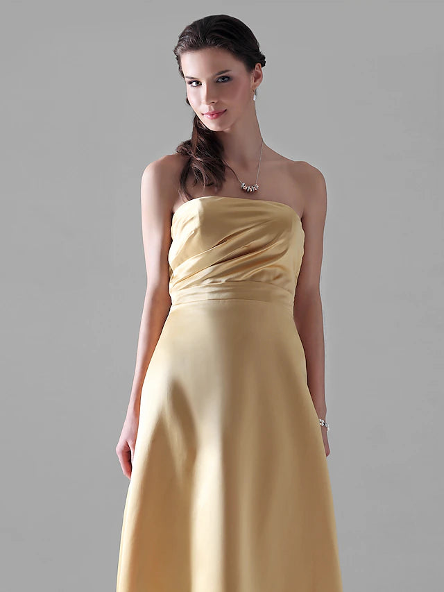 Close-up of the satin fabric and side draping detail on the formal gown.