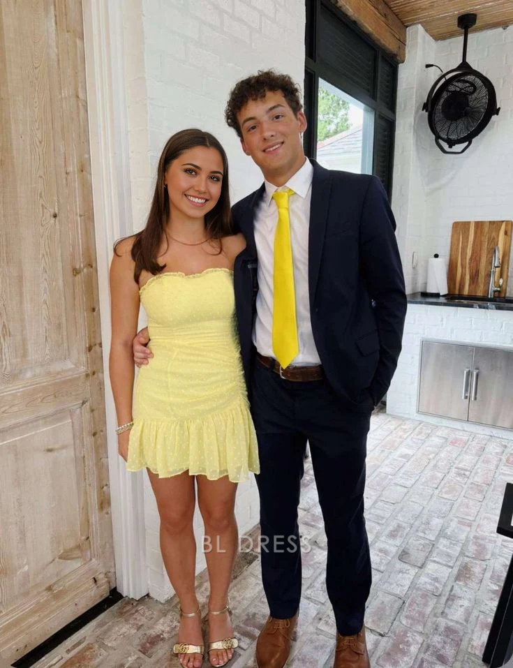 Yellow strapless short formal dress.