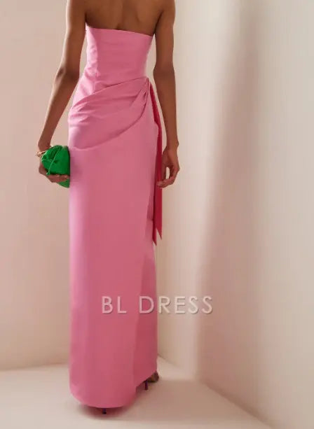 Pink strapless formal gown with a flowing silhouette.