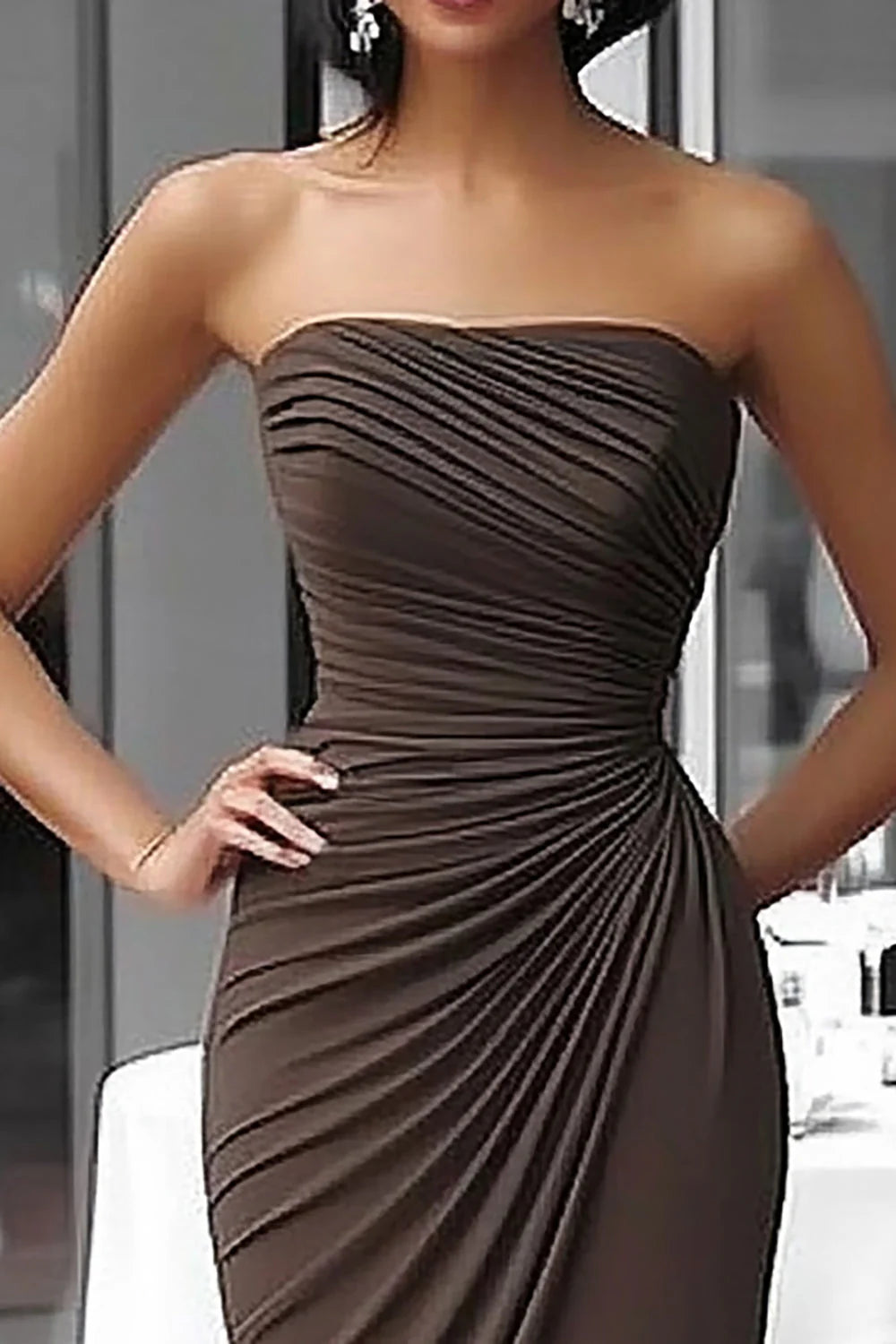 Coffee strapless ruched sheath dress, side view.