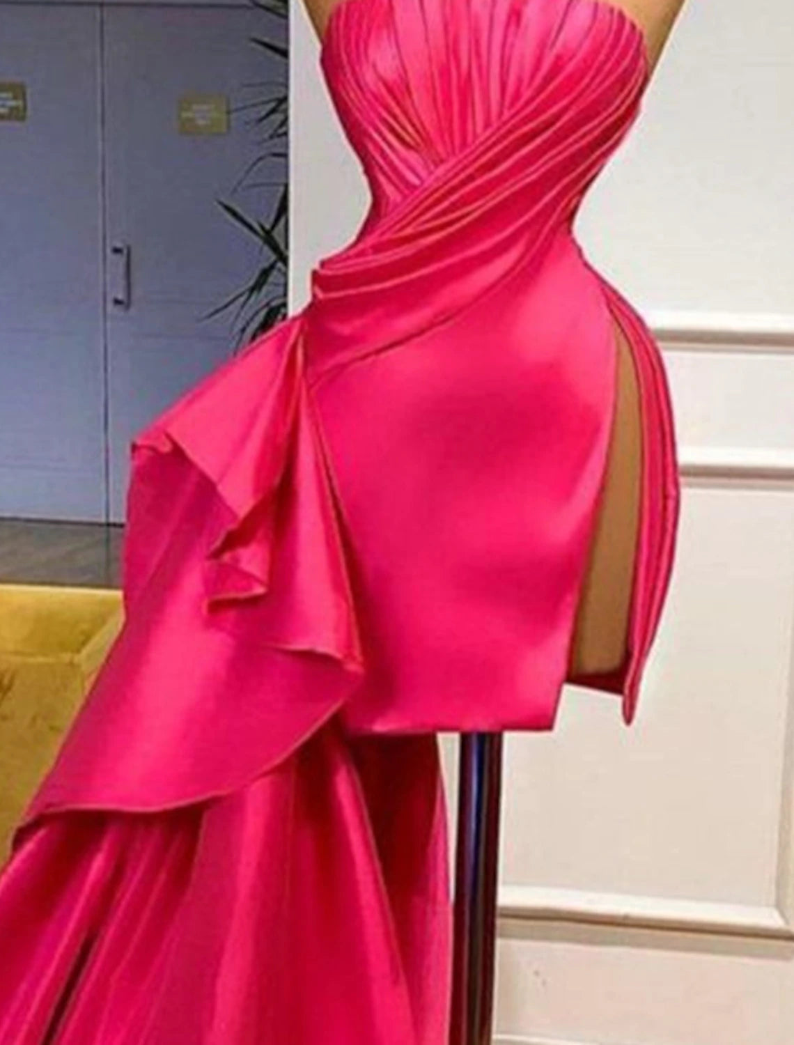 Back view of the pink strapless ruched satin mini dress.