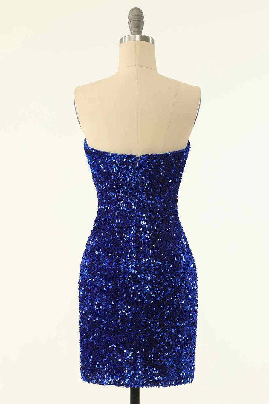 Model in a dark sequin strapless sheath dress, side view.
