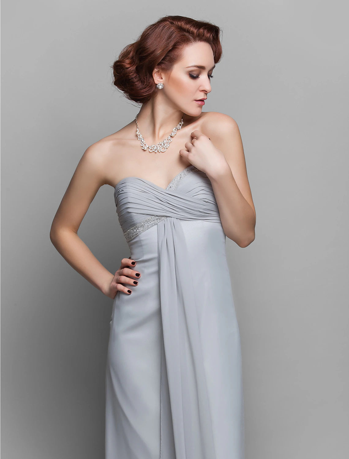 Close-up of the delicate criss-cross beading on the bodice of the formal dress.