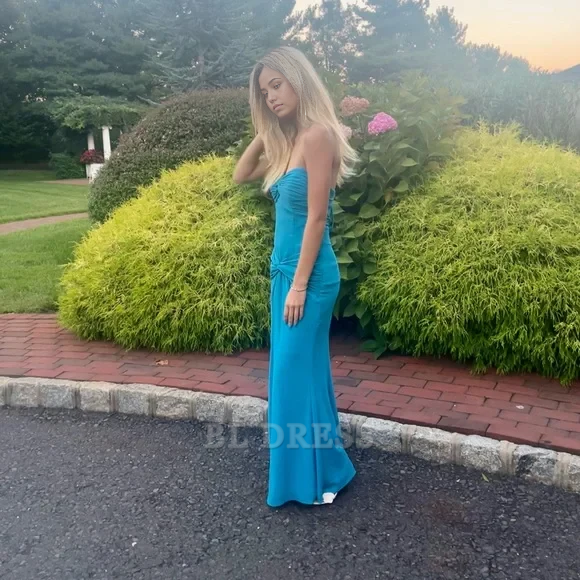 Long blue formal dress with a sweetheart neckline.
