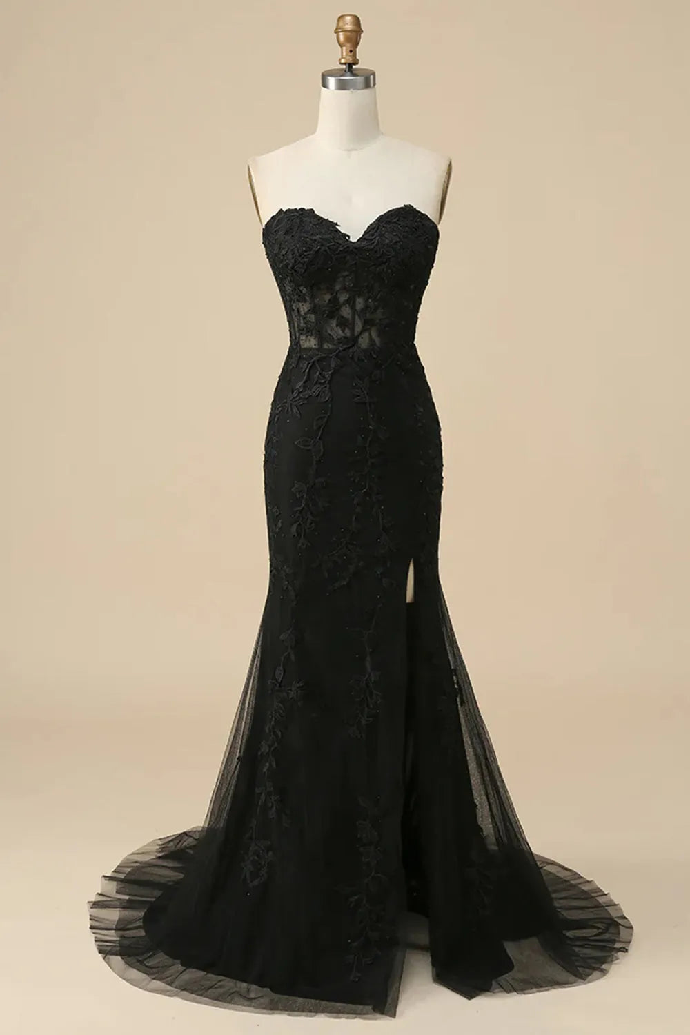 Model walking in the dark blue prom dress, emphasizing the movement of the slit.