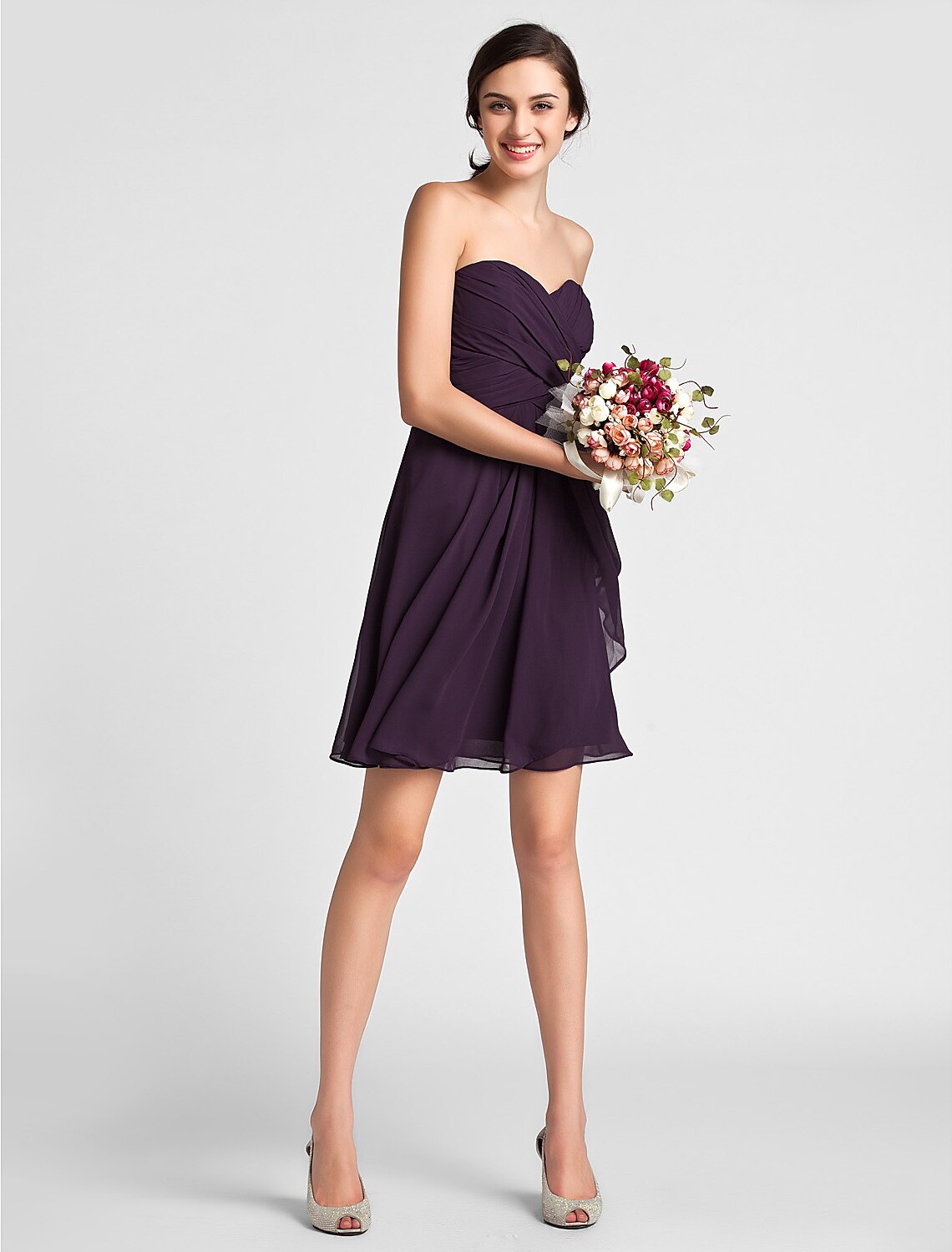 Back view of a draped knee-length bridesmaid dress.