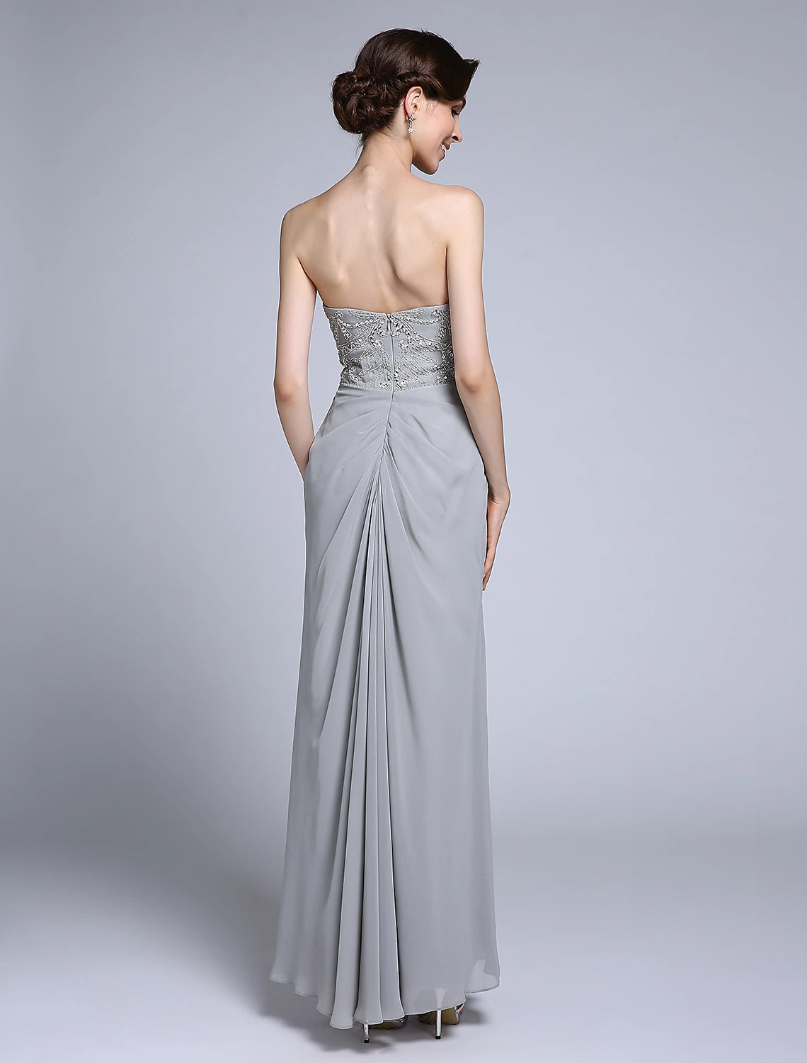 Sheath dress side view showcasing sequin side draping.