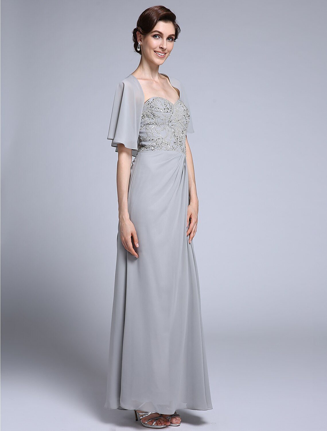 Close-up of sweetheart neckline and half sleeve on the dress.
