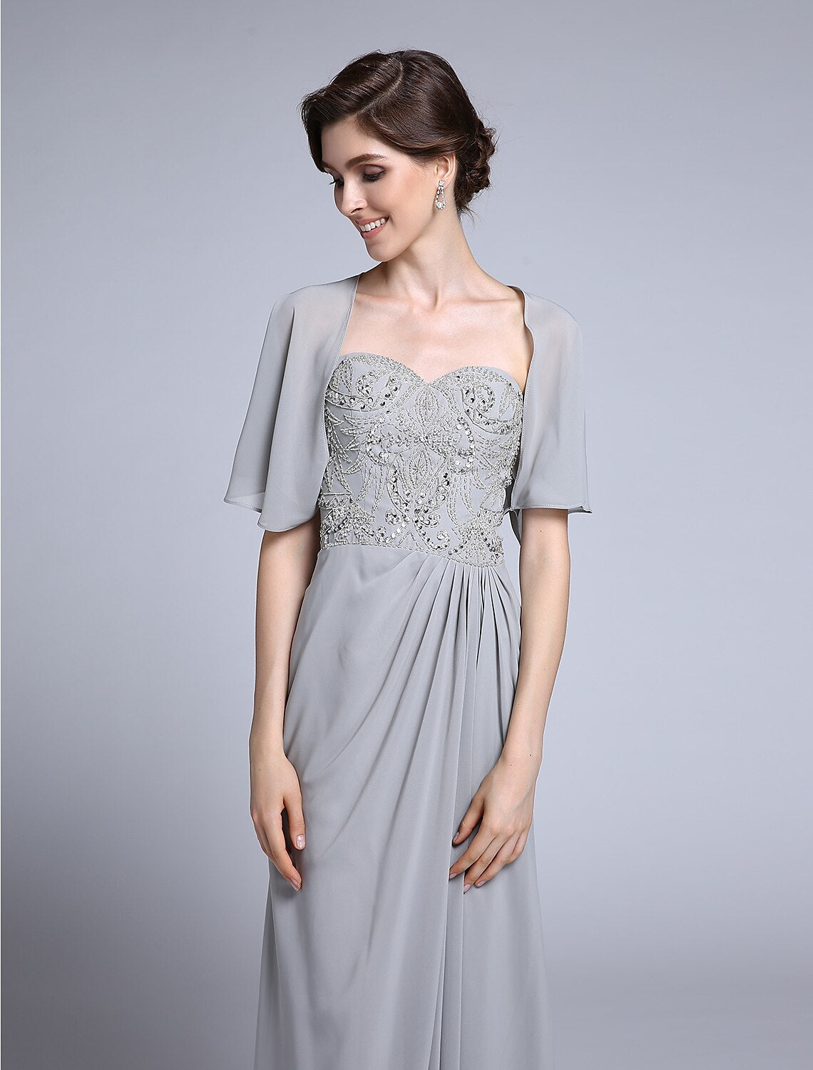 Detail of sequin embellishment and chiffon fabric on the dress.