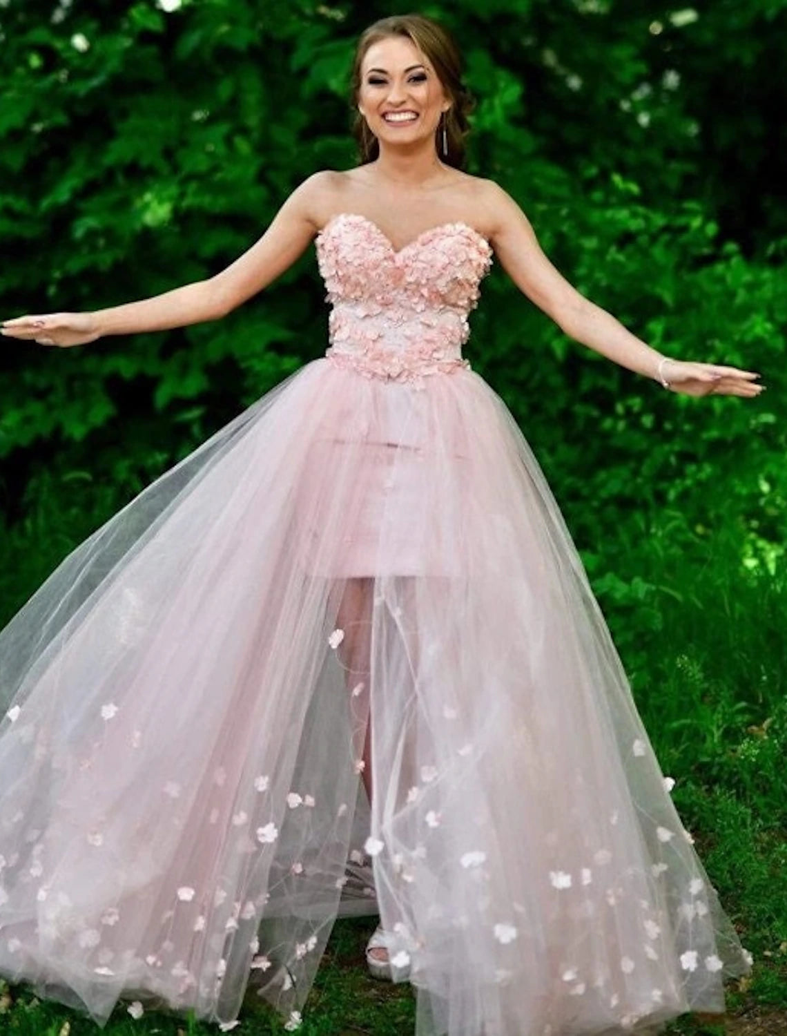 Back view of the sheath high-low prom dress showcasing the sweep train.