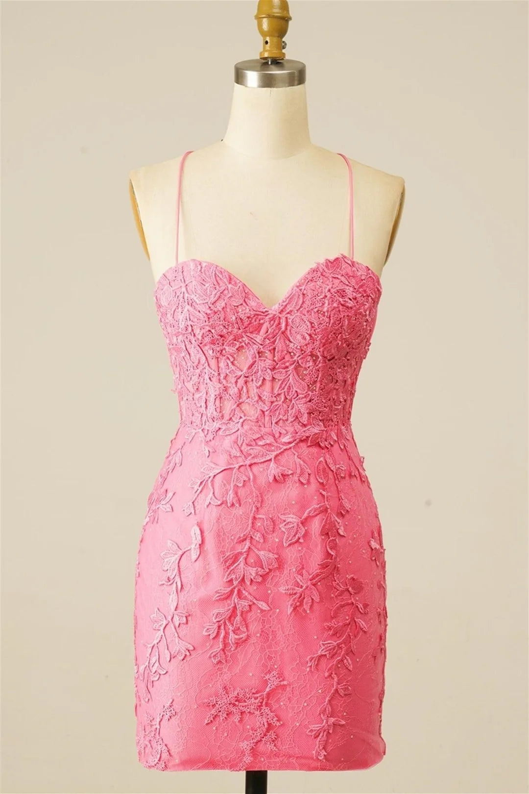 Elegant sheath homecoming dress with sweetheart neckline and appliques.
