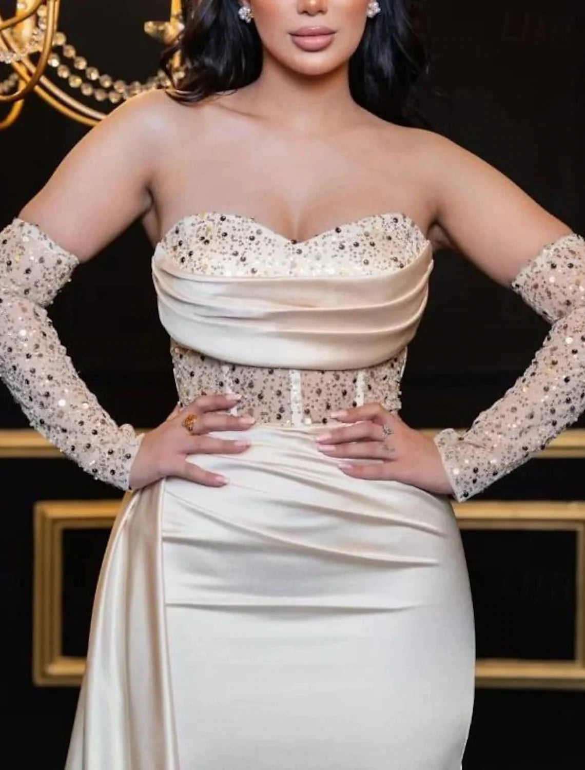 Sweetheart neckline long sleeve prom dress in satin with sequin details.