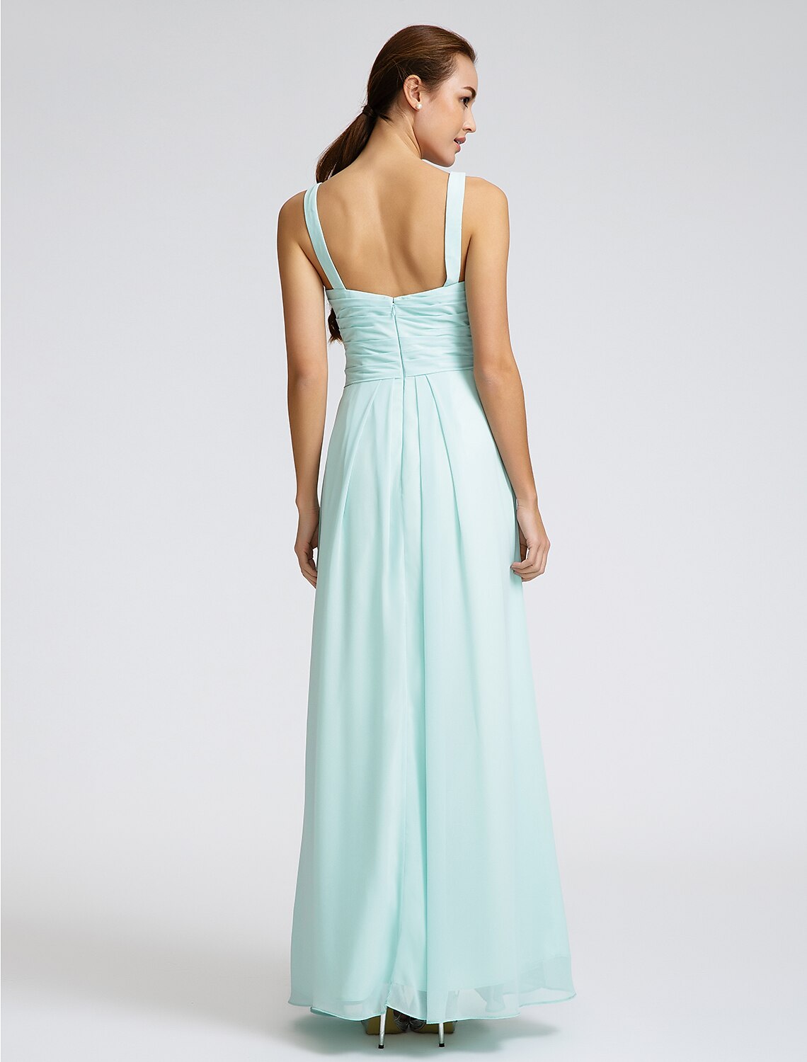 Bridesmaid dress back view showing criss-cross straps and open design.