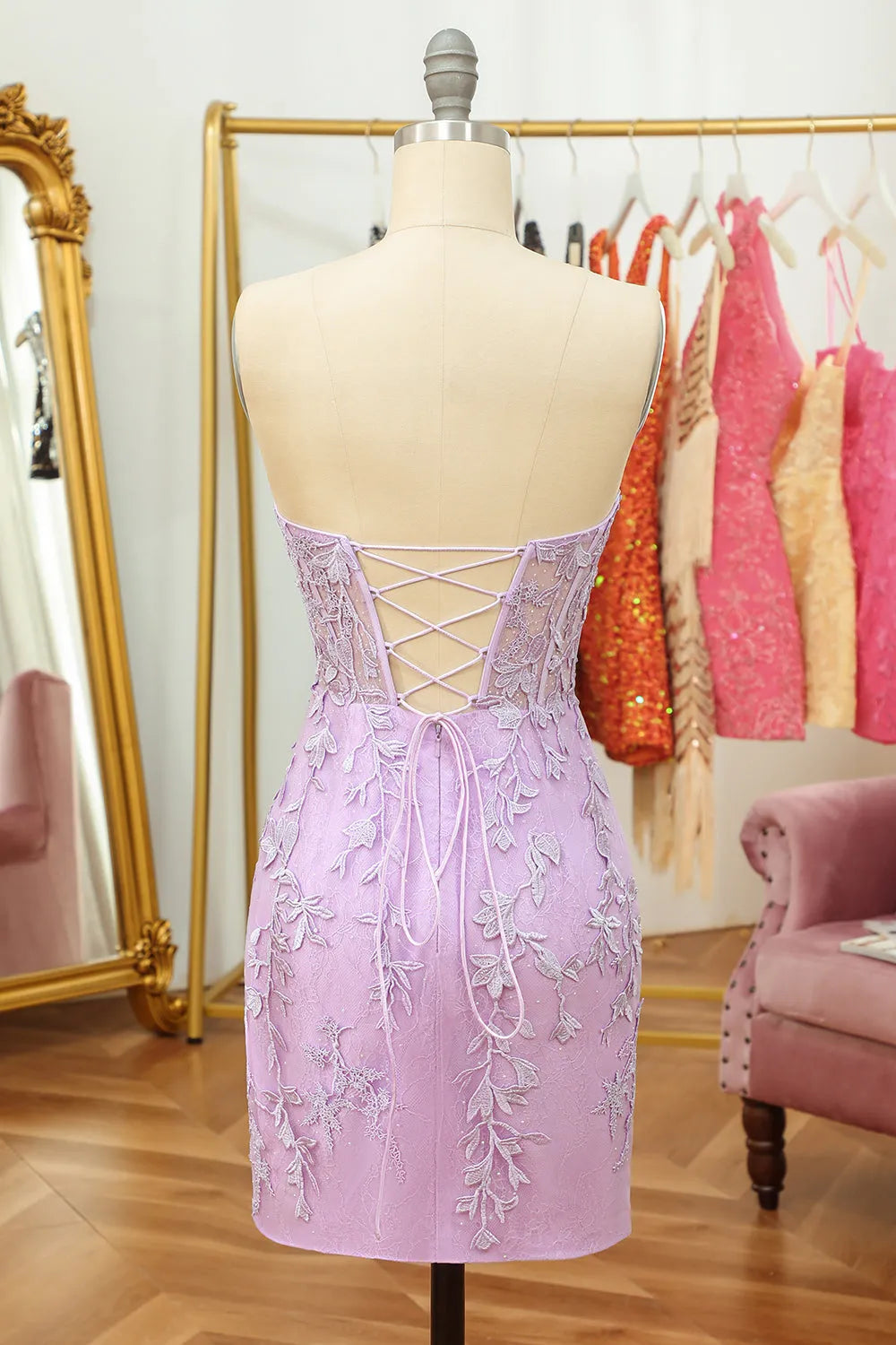 Detail of the appliques and fabric on the sheath dress.