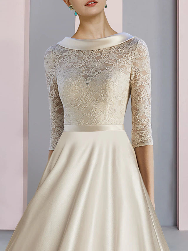 Back view of the mother of the bride dress with subtle pleats and bow detail.
