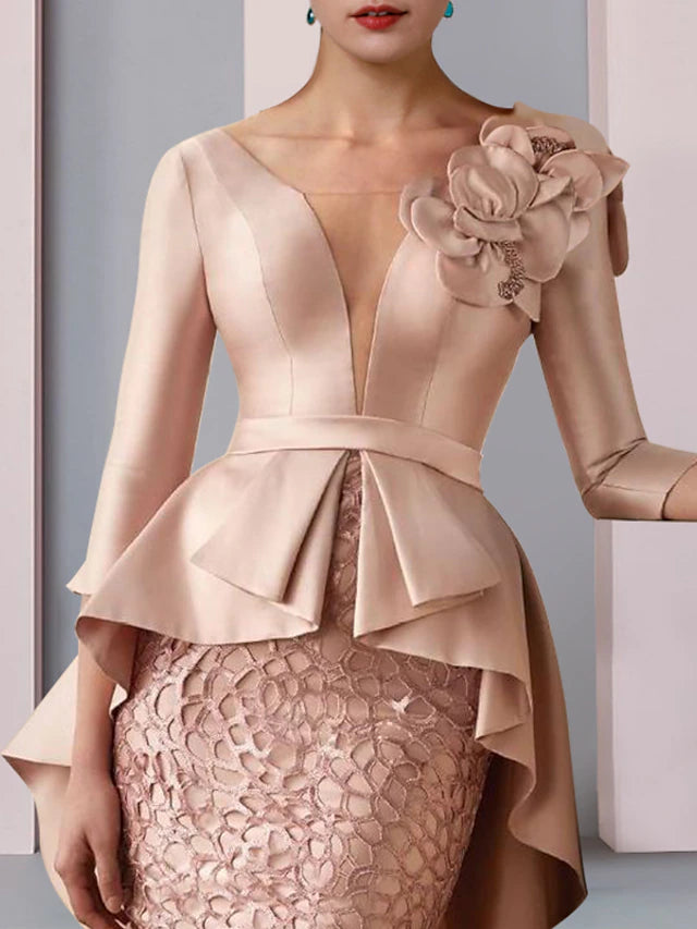 Back view of floor-length satin dress with cascading ruffles and appliques.