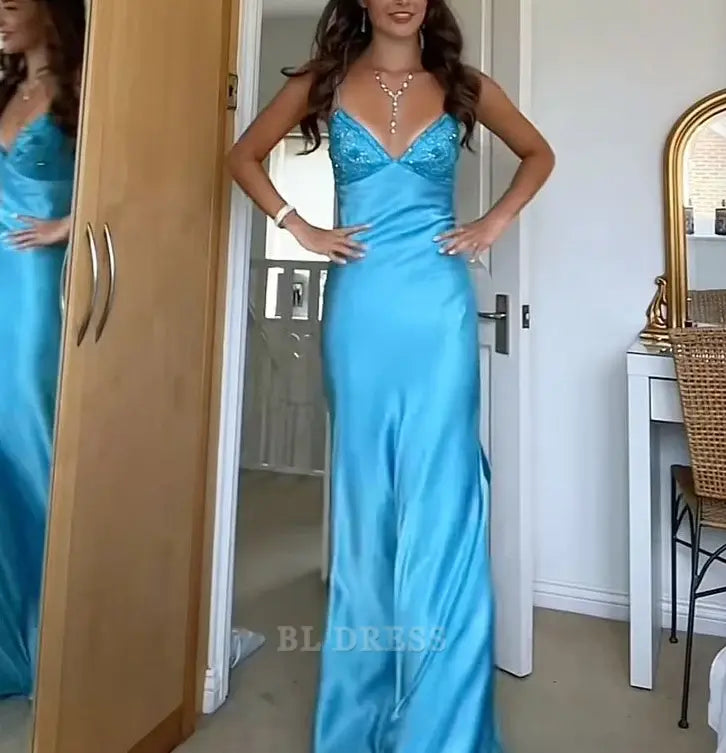 Close-up of the V-neckline on the blue formal dress.