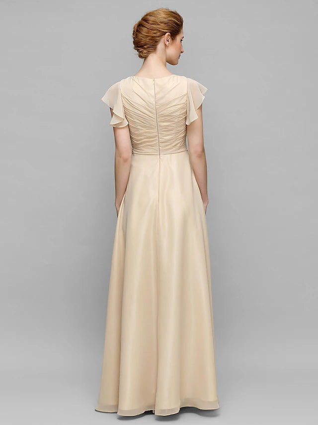 Another angle of the dark blue floor-length Mother of the Bride dress.