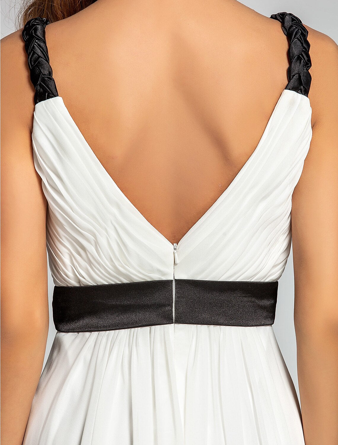 Side profile of a floor-length georgette dress.