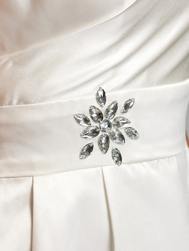 Detail of the sash and ribbon on a bridesmaid dress.
