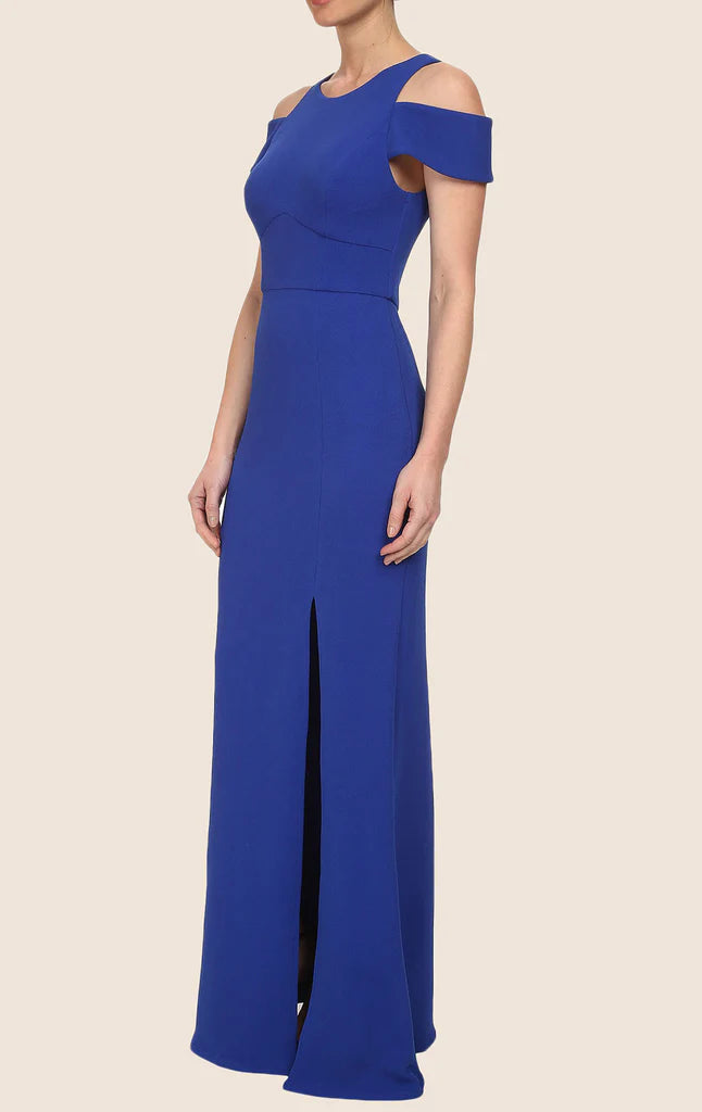 Back view of a woman in a sophisticated navy sleeveless evening gown.