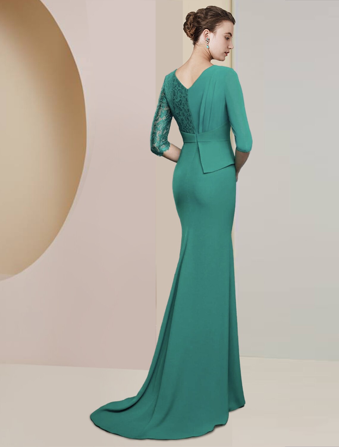 Side view of the floor-length chiffon and lace gown.