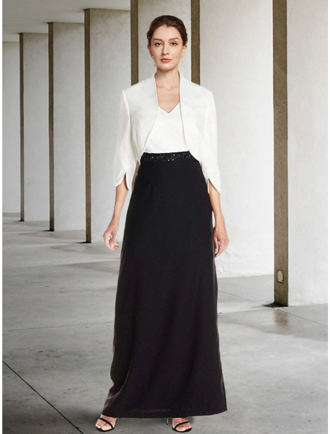 Elegant black two-piece sheath dress with V-neck, half sleeves, and sequin details.