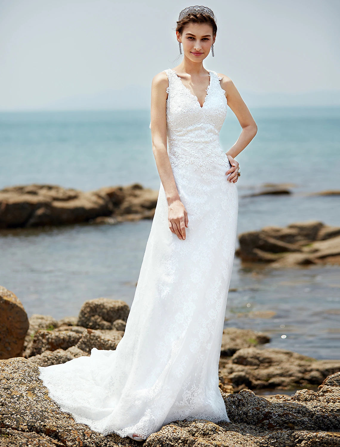 Elegant sheath V-neck wedding dress with lace appliques and court train.