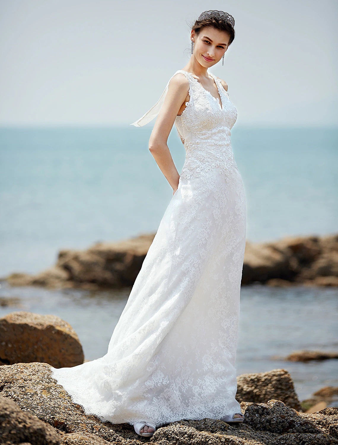 Close-up of lace appliques on a wedding dress bodice.