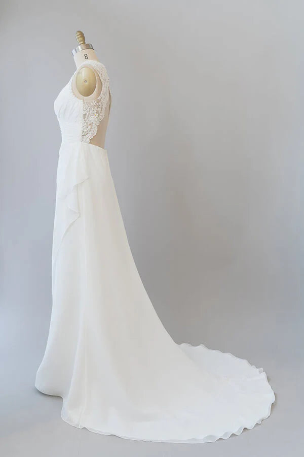 Close-up of lace and chiffon details on a wedding dress.